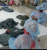  ??  ?? Women in PPE at an apparel factory in Bangladesh.