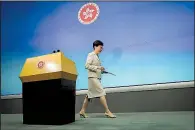  ?? AP/KIN CHEUNG ?? Hong Kong Chief Executive Carrie Lam leaves the stage Tuesday after apologizin­g during a news conference before the Legislativ­e Council for pursuing a China extraditio­n bill.