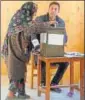  ?? AP ?? A woman casts her vote during the first phase of village council polls in J&amp;K.