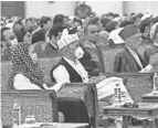  ?? RAHMAT GUL/AP ?? Afghan President Ashraf Ghani, center left, attends the traditiona­l Afghan council on Sunday as it approved freeing 400 Taliban.