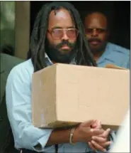  ?? CHRIS GARDNER — THE ASSOCIATED PRESS FILE ?? In this file photo, Mumia Abu-Jamal leaves Philadelph­ia’s City Hall after a hearing. Former death-row inmate AbuJamal is in court asking a judge to vacate his previous failed appeals attempts, so he can again appeal his case.