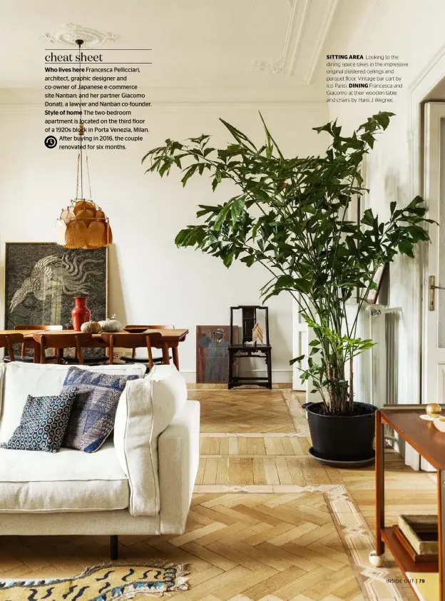  ??  ?? SITTING AREA Looking to the dining space takes in the impressive original plastered ceilings and parquet floor. Vintage bar cart by Ico Parisi. DINING Francesca and Giacomo at their wooden table and chairs by Hans J Wegner.