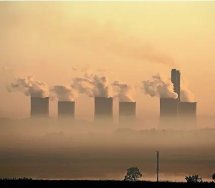  ?? PHOTO: REUTERS ?? Steam rises at sunrise from a coal-burning power station owned by state power utility ESKOM near Sasolburg, South Africa. A new study says such plants must be shut down by 2050 to prevent accelerate­d sea-level rises.