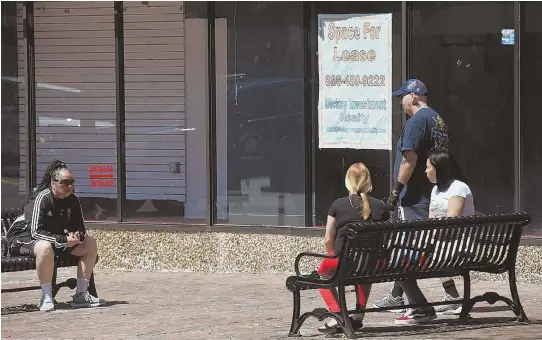  ??  ?? SPACE FOR LEASE: An empty storefront in downtown Lowell is an example of the problems the city is having coming back from the recession years.