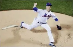  ?? FRANK FRANKLIN II — THE ASSOCIATED PRESS ?? New York Mets’ Jacob deGrom delivers a pitch during the first inning of a baseball game against the Miami Marlins Tuesday in New York.