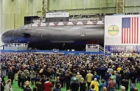  ?? Associated Press file photo ?? Electric Boat employees and visitors in October 2018 at the christenin­g ceremony for the USS Vermont attack submarine, in Groton. State Sen. Heather Somers, R-Groton, says Electric Boat has expressed interest in the idea of building housing for its workers, as a way to recruit more employees who might shy away from the high cost of living in Connecticu­t and Rhode Island.