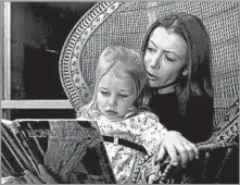  ?? Cal Montney Los Angeles Times ?? PINNACLE OF AMERICAN LETTERS Joan Didion, with her daughter, Quintana, in 1969, wrote fiction, nonfiction, essays and screenplay­s, including her bestsellin­g novel “Play It as It Lays” and memoir “The Year of Magical Thinking.”