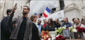  ??  ?? HIP TO BE SQUARE: Jack Dorsey, CEO of Square and Twitter, live-casts video while standing outside the New York Stock Exchange for the initial public offering of Square, in New York. PICTURE: REUTERS