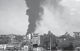  ?? AP FILE ?? Smoke rises June 8 over Khartoum, Sudan, amid fighting between the Sudanese army and paramilita­ry Rapid Support Forces.