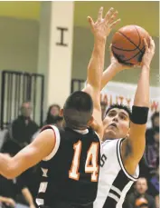  ?? NEW MEXICAN FILE PHOTO ?? Capital’s Bryan Mirabal shoots in 2004 against Taos. Now the Jaguars assistant coach, Mirabal is expected to play Saturday in an alumni game between the Jaguars and Demons.