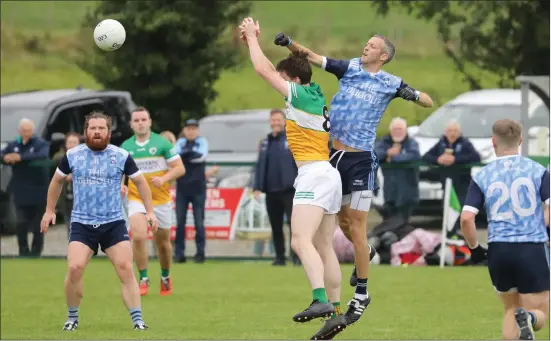  ?? ?? Derrylin’s James Dolan and Paul Mcgrath of Belcoo compete for a high ball.