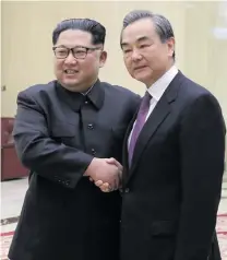  ?? Photo: Xinhua ?? Leader of North Korea Kim Jong Un (left) with Chinese State Councilor and Foreign Minister Wang Yi in Pyongyang, North Korea on May 3, 2018.