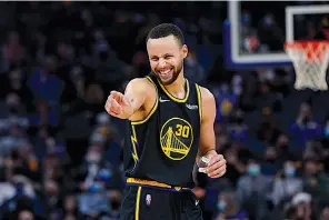  ?? Associated Press ?? Golden State Warriors guard Stephen Curry celebrates Wednesday against the Portland Trail Blazers in San Francisco.