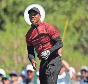  ?? JAE C. HONG/AP ?? Tiger Woods watches his tee shot on the fifth hole during the final round of the Masters on Sunday in Augusta, Ga.