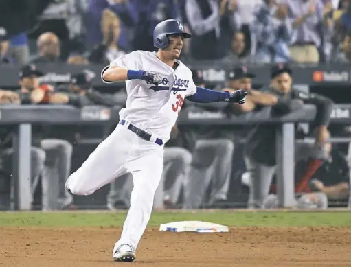  ?? Kevork Djansezian/Getty Images ?? Cody Bellinger of Los Angeles singles in the ninth inning against the Red Sox in Game 3 of the World Series at Dodger Stadium.