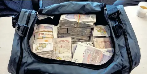  ??  ?? Nearly £1 million in banknotes was found in the back of a black cab; police believe the driver was moving illicit payments from organised crime gangs across London
