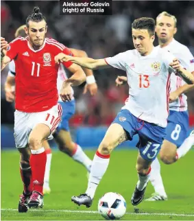  ??  ?? Aleksandr Golovin (right) of Russia