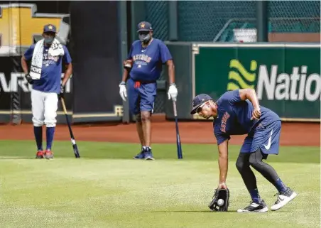  ?? Photos by Karen Warren / Staff photograph­er ?? Michael Brantley works out on Day 1 of summer camp. Fellow OF Yordan Alvarez was not in Houston for undisclose­d reasons.