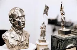  ?? DAVID FERNANDEZ/EPA ?? A bust relief of Nazi leader Adolf Hitler and other suspected artifacts were found in a hidden room of a collector’s home in a suburb of Buenos Aires, the Argentine capital.