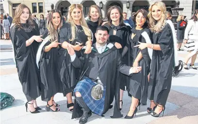  ?? Pictures: Gareth Jennings. ?? Graduates celebrate receiving their degrees at yesterday’s ceremony.