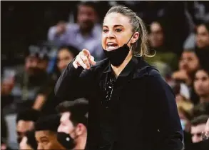  ?? Eric Gay / Associated Press ?? Becky Hammon took over as coach of the Las Vegas Aces, replacing Bill Laimbeer, after serving as an NBA assistant coach for the San Antonio Spurs since 2014. She’s one of six former players who are now head coaches in the league.