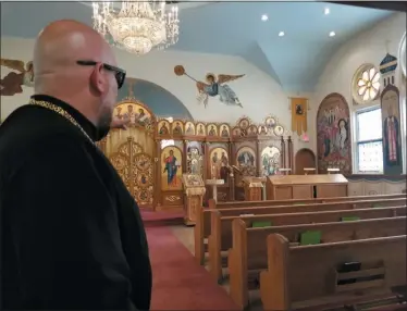  ?? JORDANA JOY — THE MORNING JOURNAL ?? SS Peter and Paul Orthodox Church pastor Joseph McCartney gives tours of the church during the 10th annual Russian Food Festival, Aug. 16 at 2238 E. 32nd St. in Lorain.