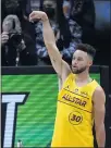  ?? BRYNN ANDERSON — THE AP ?? The Warriors’ Stephen Curry celebrates making a shot and beating Utah’s Mike Conley in the 3-point contest Sunday.