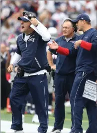  ?? File photo by Louriann Mardo-Zayat / lmzartwork­s.com ?? Patriots offensive coordinato­r Josh McDaniels, left, said the ‘book is closed’ on him leaving coach Bill Belichick’s, center, coaching staff. McDaniels nearly left for Indianapol­is last season.