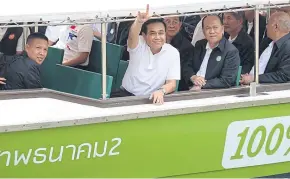  ??  ?? VIP CRUISE: Prime Minister Prayut Chan-o-cha rides an electronic boat in September to promote canal transporta­tion in Bangkok, part of the government’s seamless connectivi­ty policy.