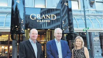  ?? PHOTO: GREGOR RICHARDSON ?? Grand unveiling . . . Outside the rebranded Grand Casino in Dunedin are (from left) director Peter Treacy, chairman Geoff Thomas and director Lani Hagaman.