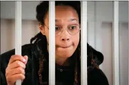  ?? AP PHOTO BY ALEXANDER ZEMLIANICH­ENKO ?? WNBA star and two-time Olympic gold medalist Brittney Griner speaks to her lawyers standing in a cage at a court room prior to a hearing, in Khimki just outside Moscow, Russia, Tuesday, July 26, 2022. A Russian court has on Tuesday, Oct. 23 started hearing American basketball star Brittney Griner’s appeal against her nine-year prison sentence for drug possession.