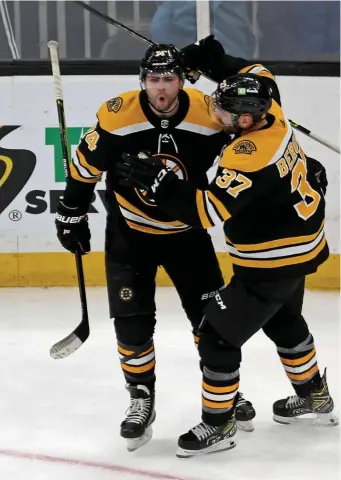  ?? STuART CAHILL / HeRALd sTAFF FILe ?? NEW MAN: Jake DeBrusk, left, has benefitted from playing with steady performers like Patrice Bergeron on the first line.