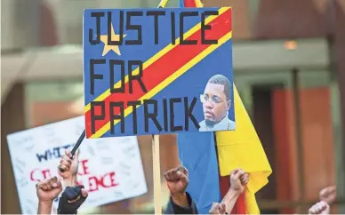  ?? CORY MORSE/THE GRAND RAPIDS PRESS VIA AP ?? Police reform activists rally for Patrick Lyoya in Grand Rapids, Mich., on April 12. Lyoya was shot by a police officer during a traffic stop