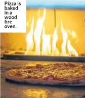  ??  ?? Pizza is baked in a wood fire oven.