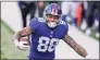  ?? Bryan Woolston / Associated Press ?? New York Giants tight end Evan Engram runs after a reception during the second half of NFL game against the Cincinnati Bengals on Sunday in Cincinnati.
