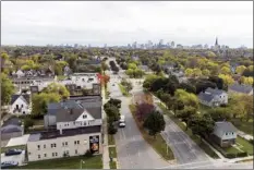  ?? AP photo ?? A neighborho­od in Milwaukee is one of many places in the country where a new method used by the U.S. Census Bureau to protect confidenti­ality in the 2020 census has made people and occupied homes vanish — at least on paper — when they actually exist in the real world.