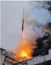  ?? REUTERS ?? FLAMES destroying the ‘twisted dragons spire’ at the Old Stock Exchange, Boersen, in Copenhagen. The spire was one of the city’s best known landmarks, symbolical­ly protecting the exchange from enemies – and from fire. |