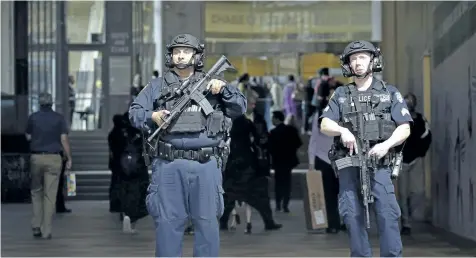  ?? BEBETO MATTHEWS/AP PHOTO ?? A New York Police Department anti-terror unit guard an entry area to Madison Square Garden, Tuesday, in New York. The NYPD says it has tightened security at high-profile locations “out of an abundance of caution” following the deadly explosion in...