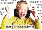  ??  ?? NOISE Girl uses headphones