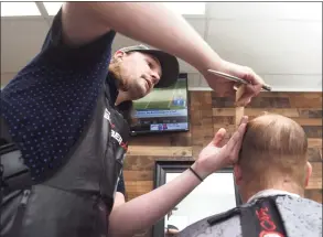  ?? Arnold Gold / Hearst Connecticu­t Media ?? Matt Conklin cuts the hair of Andrew Anziano of Orange at Matt’s Barber Shop on the Boston Post Road in Orange on Sept. 22.