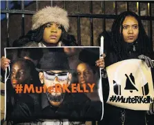  ?? ASHLEE REZIN/THE ASSOCIATED PRESS ?? #MuteRKelly supporters protested outside the singer’s studio in Chicago on Wednesday.