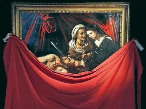  ?? AP ?? Caravaggio’s Judith and Holofernes painting is unveiled at the Colnaghi Gallery in London. The painting, lost in Amsterdam in 1617, has since been rediscover­ed in an attic in a Toulouse farmhouse in 2014.