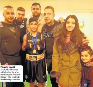  ??  ?? Family spirit Shahzman Parnez with his family after winning the Western District title earlier in the boxing calendar