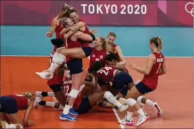  ?? FRANK AUGSTEIN - THE ASSOCIATED PRESS ?? Players from the United States react after defeating Brazil to win the gold medal in women’s volleyball at the 2020Summer Olympics, Sunday, in Tokyo, Japan.