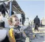  ??  ?? A child evacuated from Aleppo during a ceasefire at a refugee camp in Syria