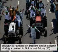  ??  ?? DISSENT: Farmers on tractors shout slogans during a protest in Noida last Friday (25)