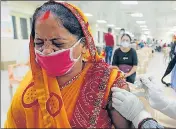  ??  ?? A beneficiar­y receiving a Covid vaccine dose during a mega vaccinatio­n drive, at Motilal Nehru Medical College, in Prayagraj on Tuesday.