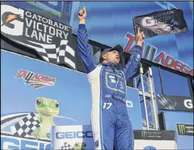  ?? DANIEL SHIREY / GETTY IMAGES ?? Ricky Stenhouse Jr., celebrates in Victory Lane Sunday at Talladega Superspeed­way. He earned his first Cup series victory and Roush Fenway Racing’s first since 2014.