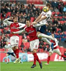  ?? PHOTOS: GETTY IMAGES ?? Harry Kane heads home Tottenham Hotspur’s winner in a London derby win over Arsenal.