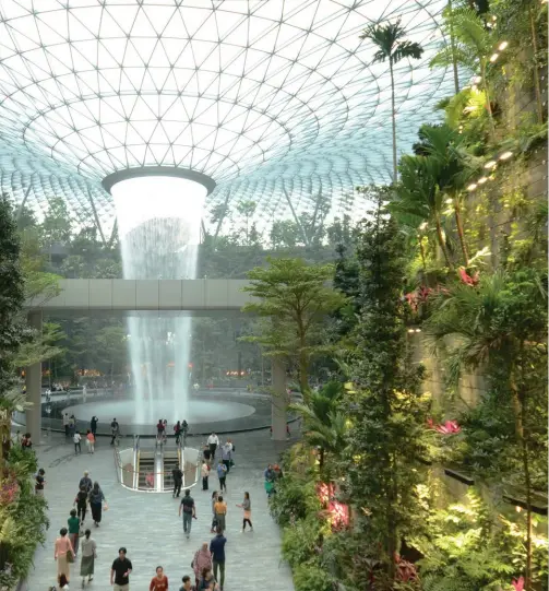  ??  ?? From top: The Rain Vortex in Jewel Changi Airport has recirculat­ed, natural rainwater, which helps provide cooling and airflow in the garden; a rendering of the Sentosa-brani Master Plan